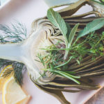 Adding fresh herbs to the water that you steam your artichoke in a great way to add flavor.