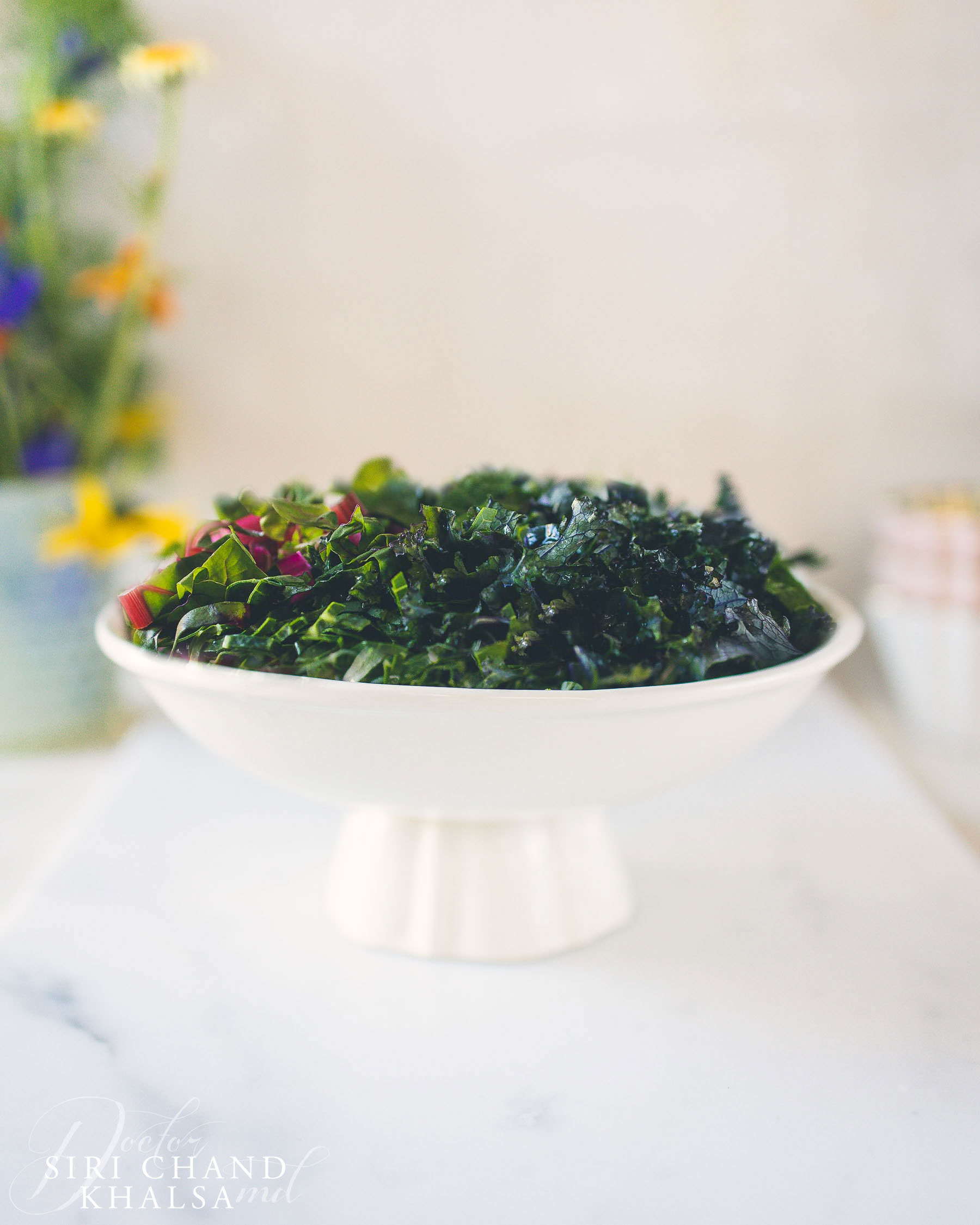 bowl of kale and greens basis for Vegan Pinto Bean Kale Soup
